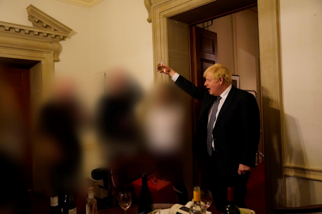 An image from Sue Gray's report showing Boris Johnson raising a glass at an event in Downing Street during pandemic lockdown.