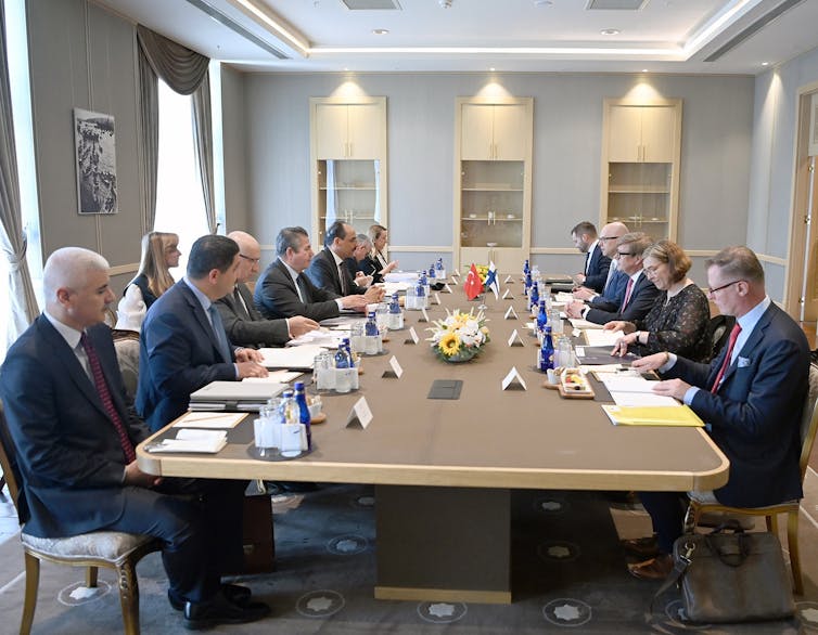 Turkish and Finnish negotiators in talks around a boardroom table in Ankara, May 25 2022.