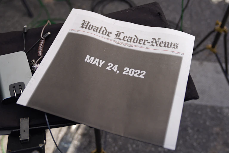 A newspaper named the 'Uvalde Leader-News' is shown with the date 'May 24, 2022' in white block print on top of a totally black front page.