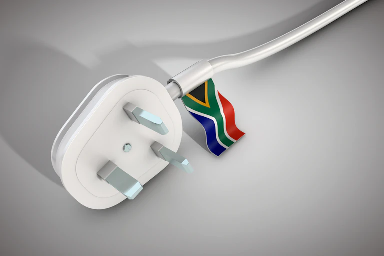 Electrical power cable and plug with South African flag.