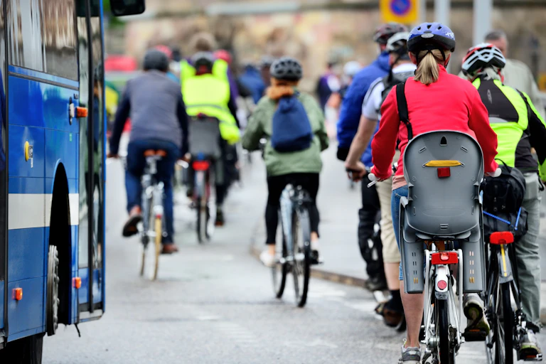 People commute on their bikes