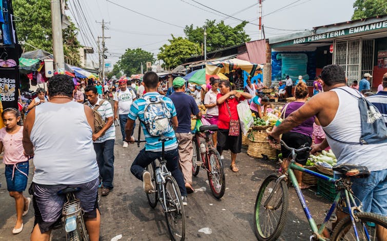 People on bikes fill a street