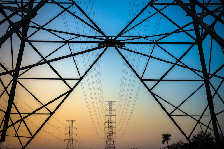 Electrical transmission towers at sunset.