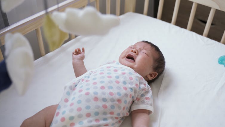 Baby in cot crying