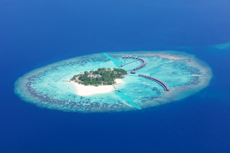 Atoll in deep blue sea