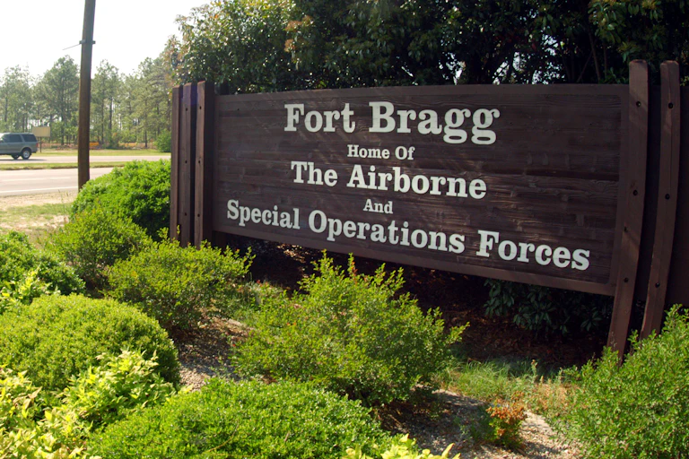 A sign reading Fort Bragg shows the name of a Confederate general that the base is named.