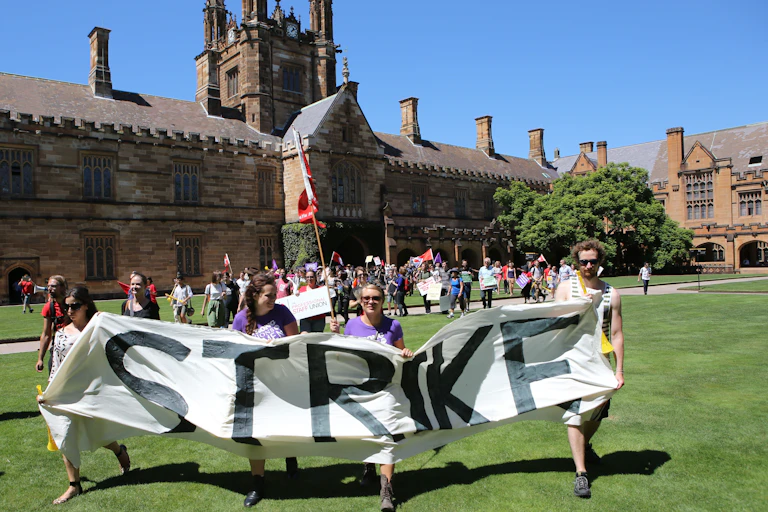 Staff on strike in front of university buildings