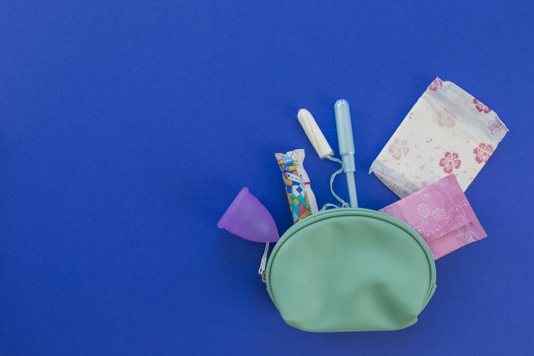 purse with period products spilling out