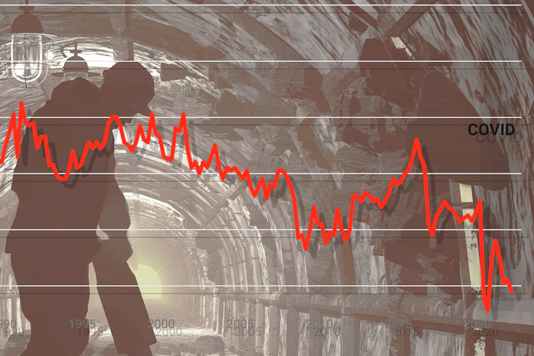 Graph superimposed over picture of worker using a power tool