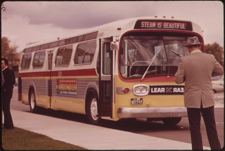 A bus in the 1970s emblazoned with the words 'Steam Is Beautiful.'