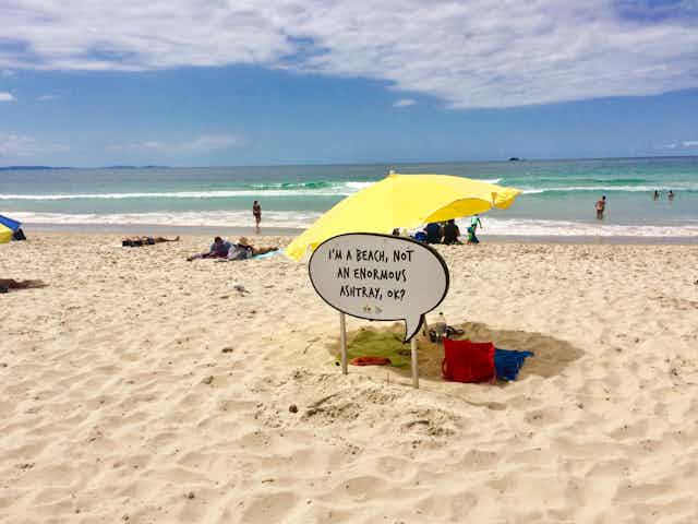 Sign on beach saying "I'm a beach, not an enormous ashtray, ok?"