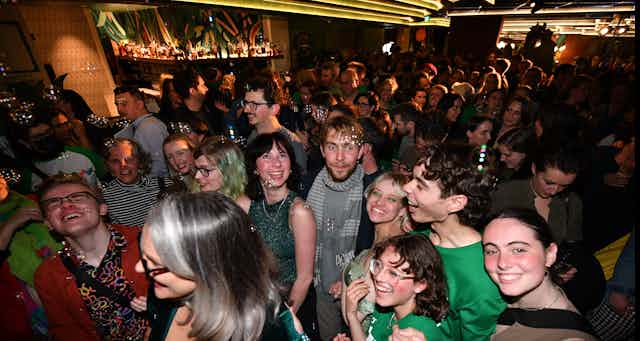 Greens supporters celebrate on election night. 