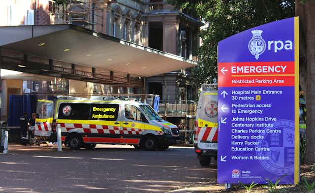 hospital emergence entrance with signs, ambulances