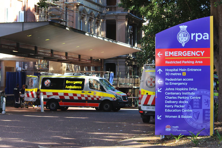 hospital emergence entrance with signs, ambulances