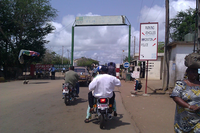 Men riding motor bikes on a road