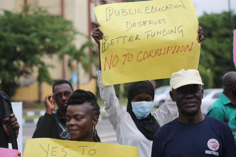 Two women holding placards