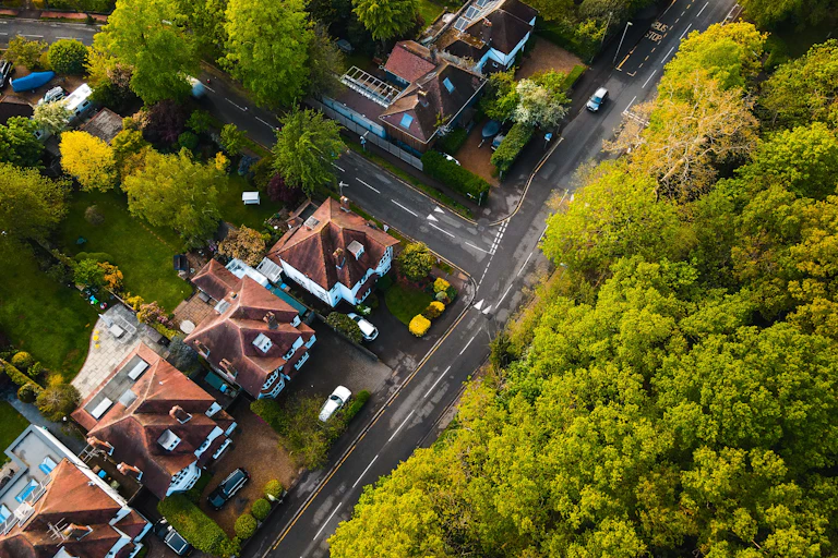 Aerial view of a Residential neighbourhood with urban forest around it