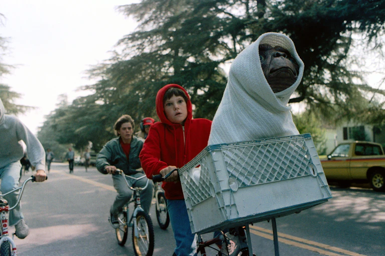 Film still, Elliott and ET on a bike