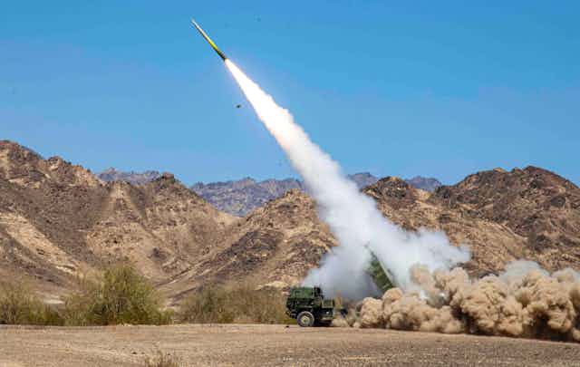 US marines firing a M142 High Mobility Artillery Rocket System (Himars) at a firing range in California, April 13, 2022.