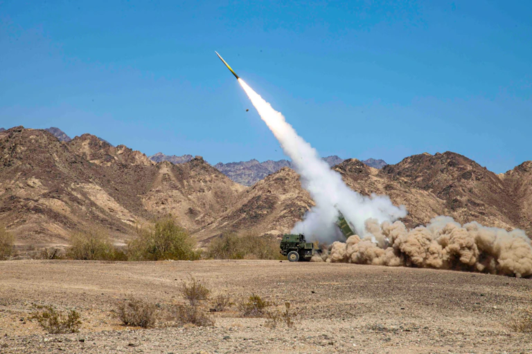 US marines firing a M142 High Mobility Artillery Rocket System (Himars) at a firing range in California, April 13, 2022.