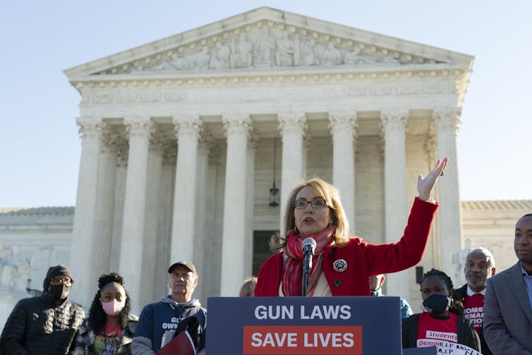 Former Representative and gun violence survivor Gabby Giffords outside the U.S. Supreme Court in Washington.