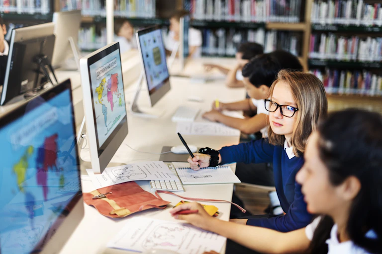 Children doing schoolwork on computers