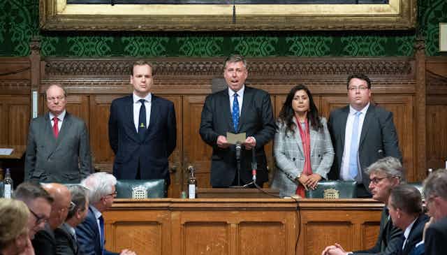 Graham Brady, the chair of the 1922 committee, flanked by colleagues as he announces the result of the no-confidence vote in Boris Johnson's leadership of the Conservative Party.