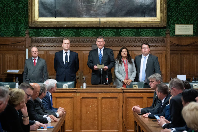 Graham Brady, the chair of the 1922 committee, flanked by colleagues as he announces the result of the no-confidence vote in Boris Johnson's leadership of the Conservative Party.