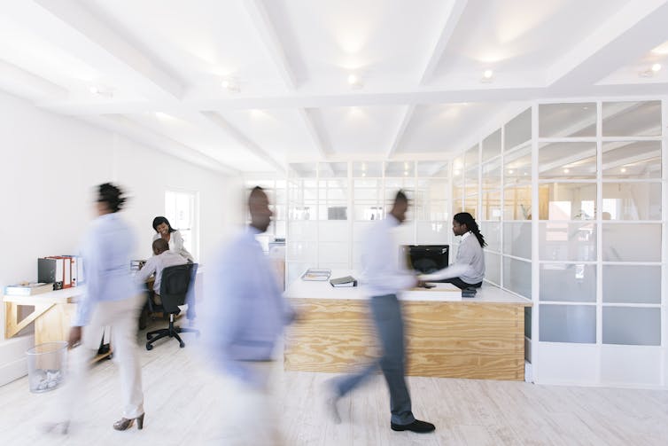 blurred Black office workers