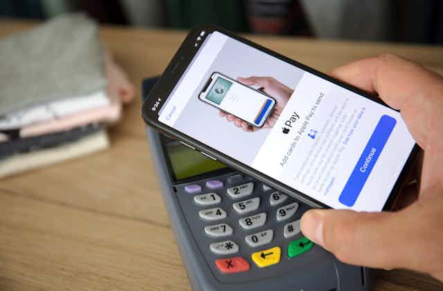 Smartphone with Apple Pay on it is used to make an EFTPOS payment 