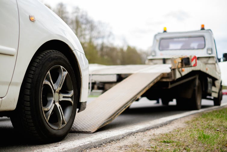 Car ready to be loaded onto a breakdown lorry.