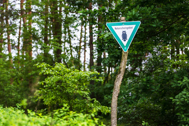 German nature reserve sign in woods