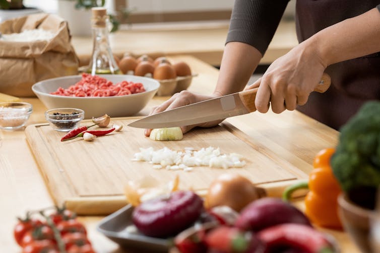 Person chopping onion