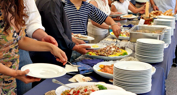 People eating at a buffet