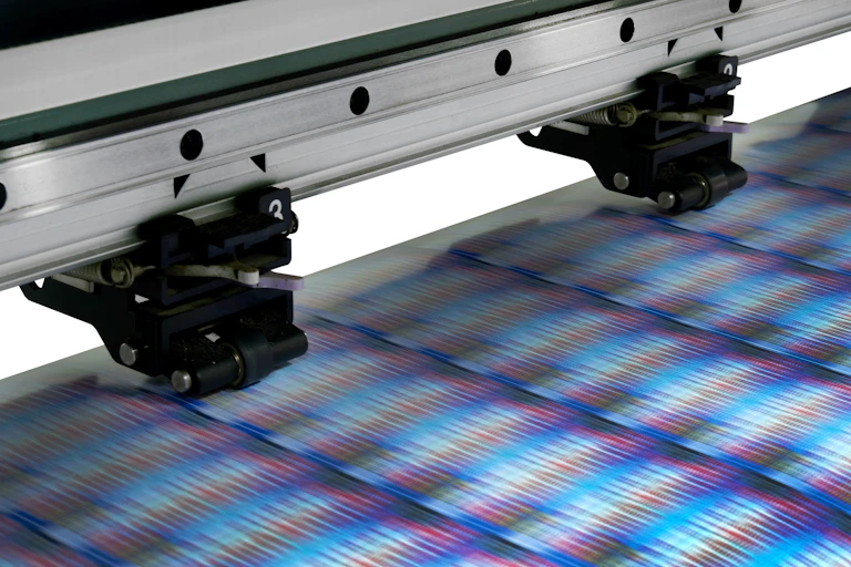 Printer printing reams of color images.
