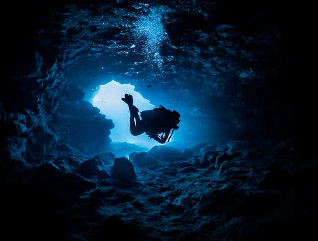 A diver in a cave