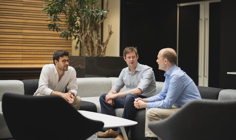 Three clinicians inside Big Data Institute, Oxford