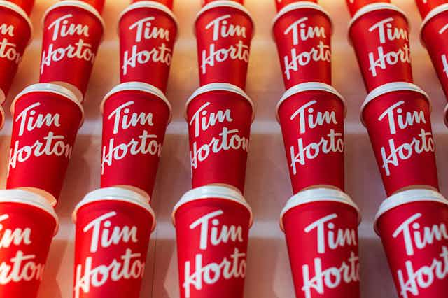 rows of red coffee cups with the Tim Hortons logo