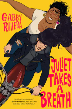 Two women riding a motorbike