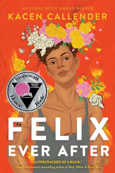A boy wearing a flower bouquet on his head