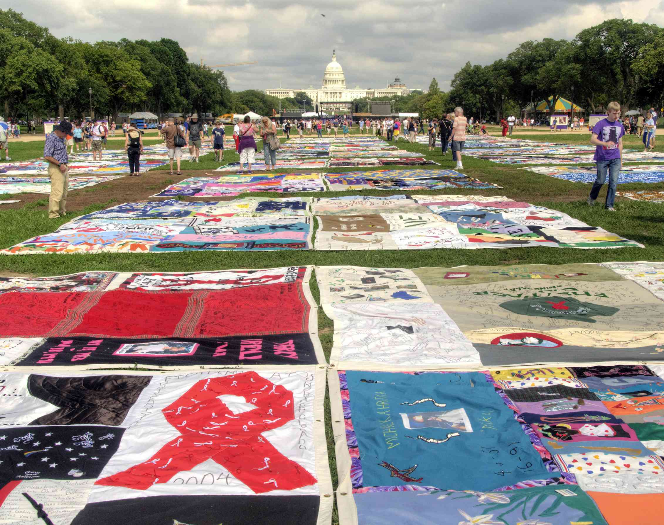 A number of large-scale quilted pieces installed on the ground in Washington DC.