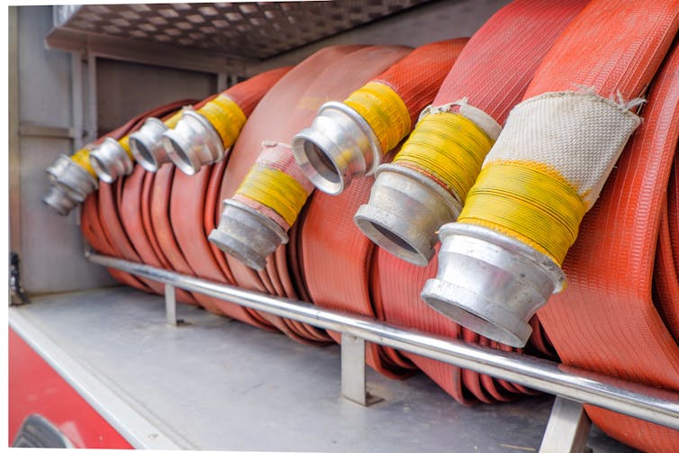 Fire hoses rolled up on a fire truck