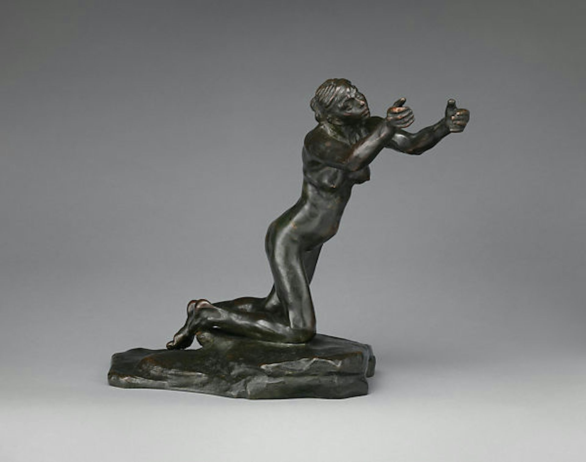 A statue of a begging woman.
