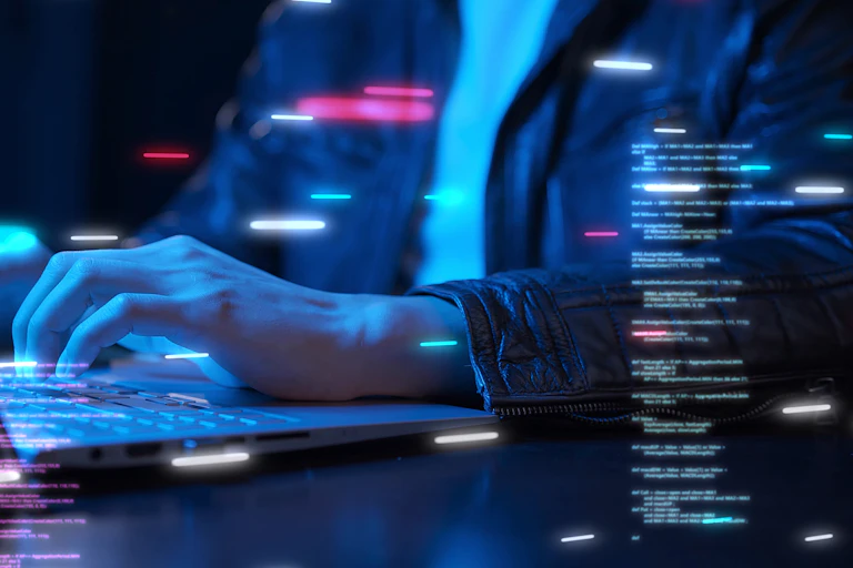Photo illustration showing computer user and computer code.