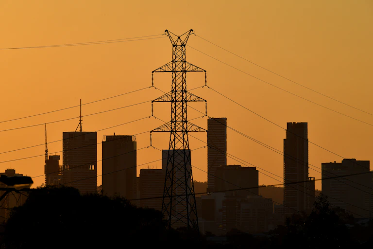 powerlines against yellow sky