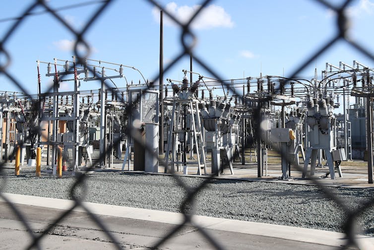 electricity infrastructure behind fence