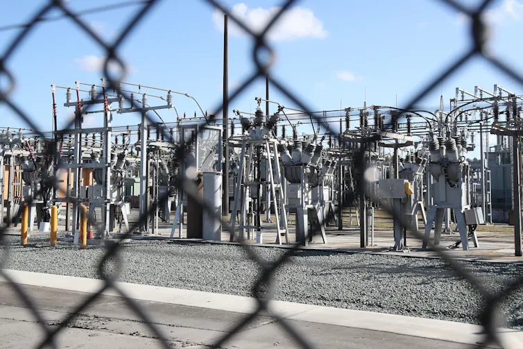 electricity infrastructure behind fence