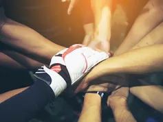 Hands holding other hands.
