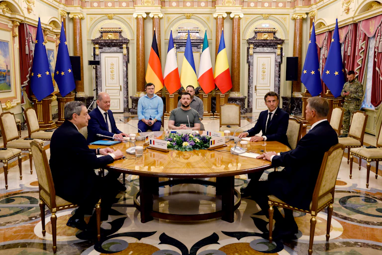 Italian Prime Minister Mario Draghi, German Chancellor Olaf Scholz, Ukrainian President Volodymyr Zelensky, French President Emmanuel Macron and Romanian President Klaus Iohannis sit round a table at the Mariinsky Palace, in Kyiv, JUne 16 2022.