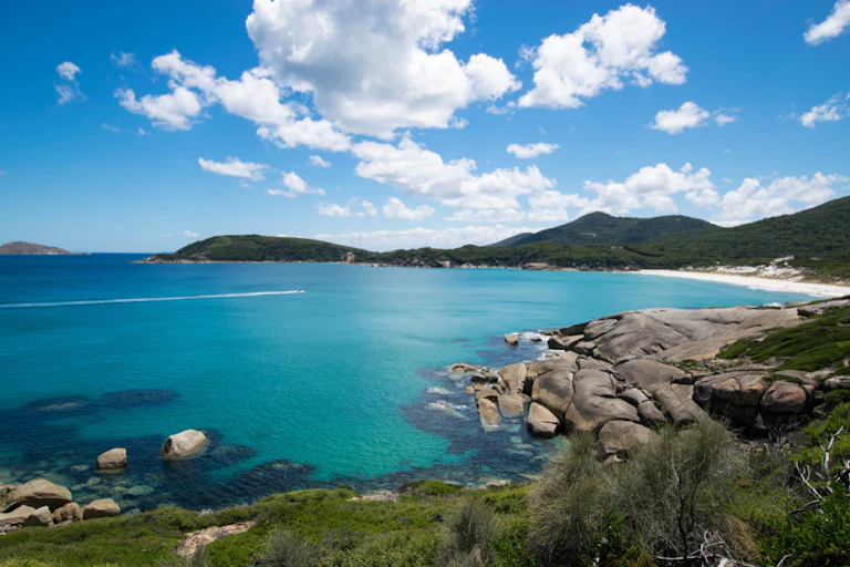 A rocky bay with sea around it.